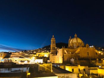 Illuminated historic building against sky at night