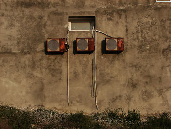 Rusty air conditioning units in a row