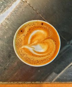 High angle view of cappuccino on table