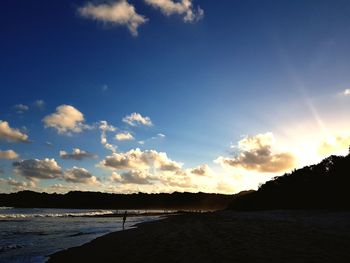 Scenic view of beach against sky during sunset