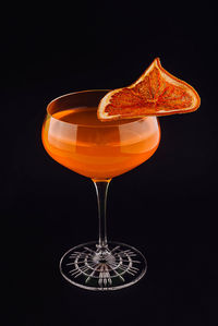 Close-up of drink against black background