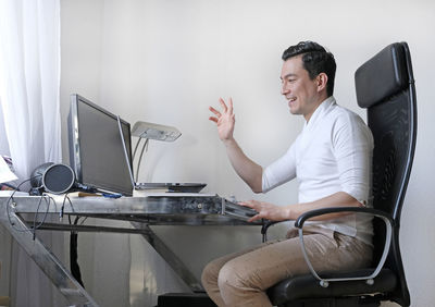 Man using computer on table