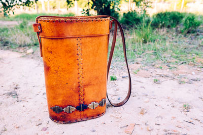 Close-up of rusty metal on field