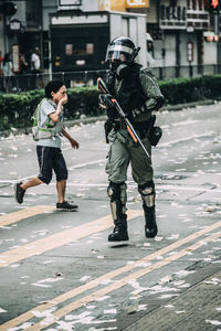 Full length of friends on street in city