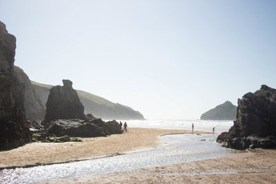 Scenic view of beach against clear sky