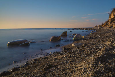 Scenic view of sea against sky during sunset