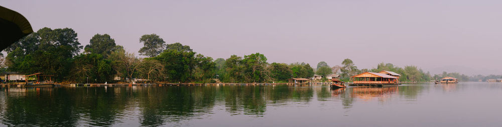 Scenic view of lake and trees against sky