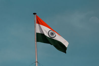 Low angle view of flag against sky