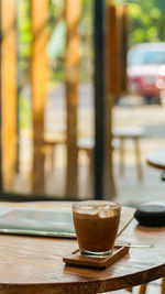 Close-up of coffee served on table at cafe