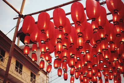 Low angle view of lanterns hanging on ceiling of building