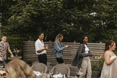 Friends having meal in garden