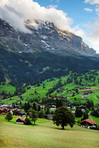 Scenic view of green landscape against sky