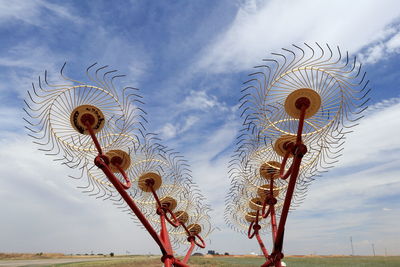 Low angle view of metallic built structure against sky