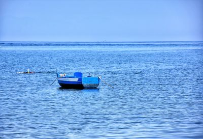 Boat in sea against clear sky