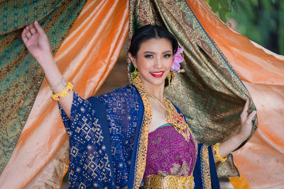 Portrait of smiling woman in traditional clothing