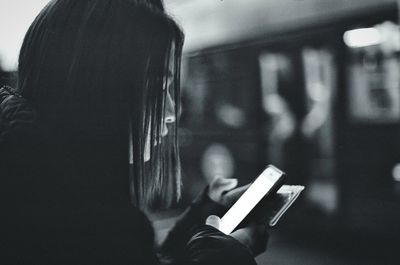 Close-up of woman using mobile phone