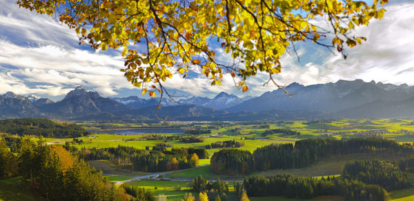 Scenic view of landscape and mountains against sky