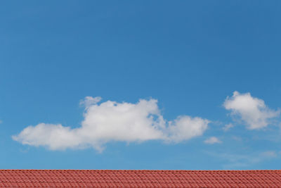 Low angle view of building against cloudy sky