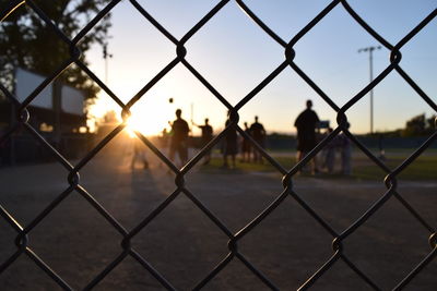 Close-up of chainlink fence against sky