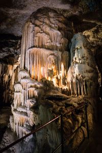 Low angle view of illuminated cave