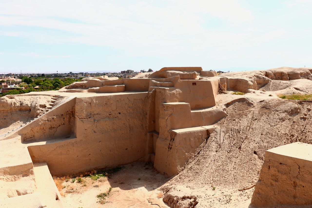 sand, architecture, wall, nature, ancient history, soil, land, built structure, sky, day, ruins, no people, history, sunlight, rock, the past, outdoors, building exterior, fortification, desert, industry, ancient, travel destinations, cloud