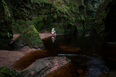 Water flowing through rocks in forest