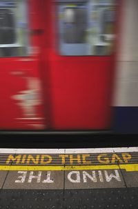 Blurred motion of train at railroad station