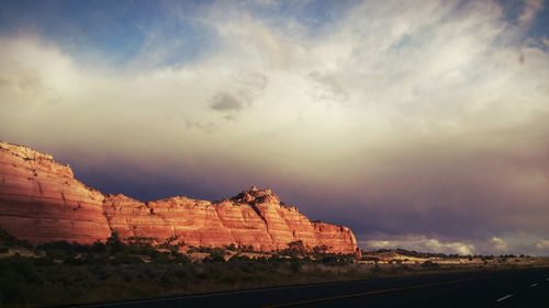 Scenic view of mountains against cloudy sky