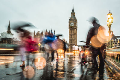 Blurred motion of wet street in city during rainy season