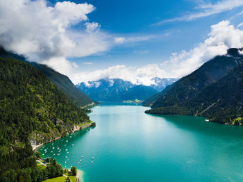 Scenic view of lake and mountains against sky