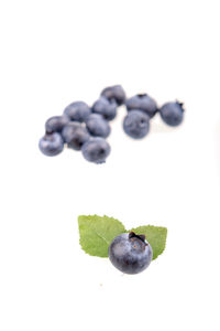 Close-up of fruits against white background