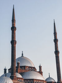 Low angle view of mosque against clear sky