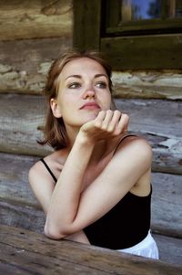 Young woman sitting at table