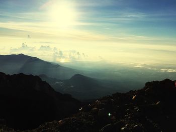 Scenic view of mountains against sky during sunset