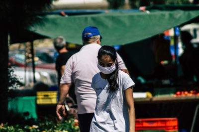 Rear view of man and woman on street