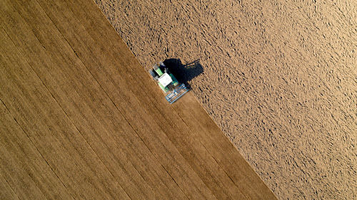 High angle view of umbrella on road