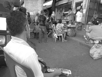 Rear view of people sitting outdoors