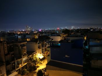 High angle view of illuminated cityscape against sky