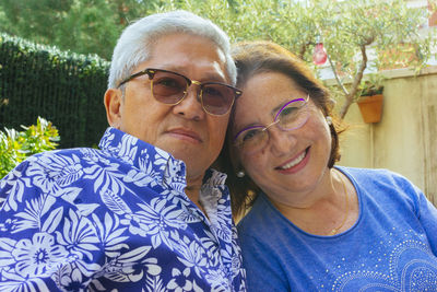 Portrait of smiling senior couple wearing eyeglasses