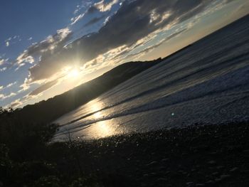 Scenic view of sea against sky at sunset