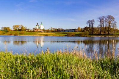 Landscape of nature at sunset.  reflection of the orthodox church in a pond with blue water.