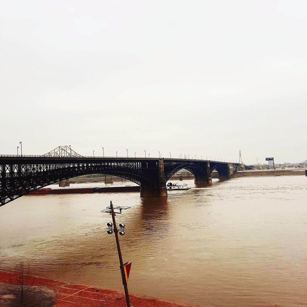 bridge, water, architecture, built structure, sky, transportation, nature, sea, travel destinations, no people, morning, city, outdoors, day, shore, reflection, travel, pier, copy space, clear sky, building exterior, coast, mode of transportation, arch, tranquility, beauty in nature, tourism, dusk