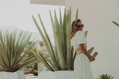 High angle view of woman standing against wall