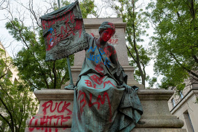 Low angle view of statue against building