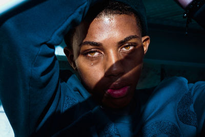 Close-up portrait of young woman in car