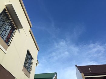 Low angle view of building against blue sky