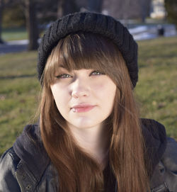 Close-up portrait of teenager with lip piercing