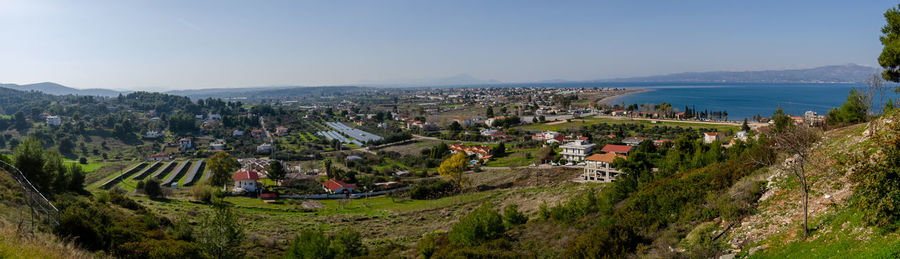 High angle view of buildings in town against sky