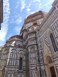 Low angle view of ornate building against sky