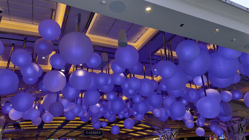 Low angle view of balloons against ceiling